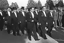 Image 8Adnan Menderes, İsmet İnönü, and the other members of the Parliament wearing a white tie and top hat. (from Culture of Turkey)