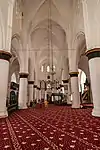 The carpet pattern marks the ranks for the faithful to pray towards Mecca (obliquely on the right) in the Selimiye Mosque of Northern Nicosia