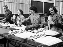 Image 32Workers inspecting practice bombs at a factory in South Australia during 1943 (from Military history of Australia during World War II)