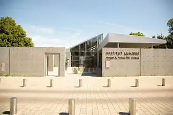 The present-day entrance to the institute, with a glass projection displaying where factory workers were captured on film leaving the factory