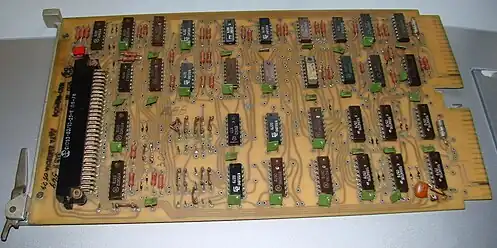 1970s I1 parallel interface board for Electronika 60.  The green rectangular parts are decoupling capacitors.