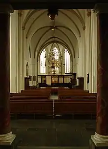 Stage and pews of a cathedral.