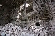 Part-collapsed interior wall of north wing extension