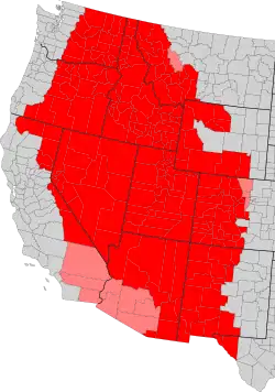 Map of the Intermountain West by county. Counties in red are always included, while counties in pink are only sometimes included.