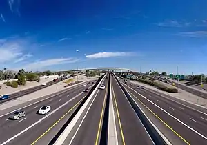 Looking over a highway towards an elevated interchange