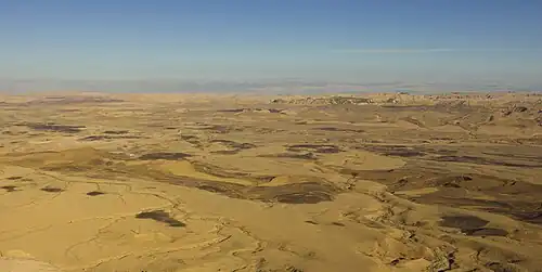 Image 16An aerial view of Makhtesh Ramon, a geological feature of Israel's Negev desert. Located some 85 km south of the city of Beersheba, the landform is not an impact crater from a meteor nor a volcanic crater formed by a volcanic eruption, but rather is the world's largest "erosion cirque" (steephead valley or box canyon).