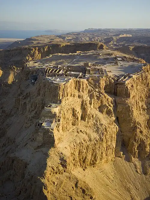 Image 1An aerial view of Masada in the Judaean Desert, with the Dead Sea and Jordan in the distance