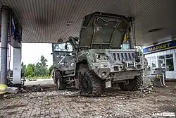 A destroyed green Russian vehicle