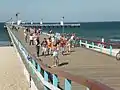 Pedestrians and bicycle drivers on the pier