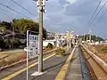 A view of the island platform and tracks, looking in the direction of Kikitsu.