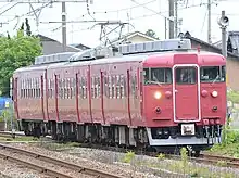 Set B04 in JR-West all-over crimson Nanao Line livery in June 2015