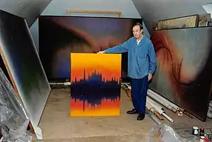 James Hilleary in his Studio with one of his Reflections Series works