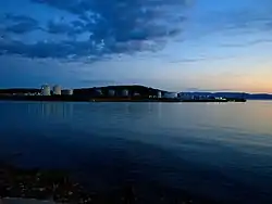 Fuel tanks and tanker mooring facilities on a shore