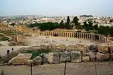 Image 2Forum of Gerasa (Jerash in present-day Jordan), with columns marking a covered walkway (stoa) for vendor stalls, and a semicircular space for public speaking (from Roman Empire)