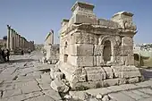 Two plinths of the South Tetrapylon at Jerash, presumed to be a tetrakionion, with a view down the colonnaded street