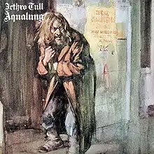 A painting depicting a bearded, long-haired man standing hunched over and reaching into his long coat. At top left is white text reading "Jethro Tull" and "Aqualung" set in a blackletter typeface.