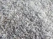 A closeup photograph of salt growths on the crust of a dry lake.