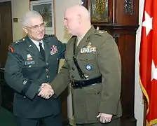 New York Naval Militia Major General Robert Wolf (right), is congratulated by Major General Joseph Taluto (left).