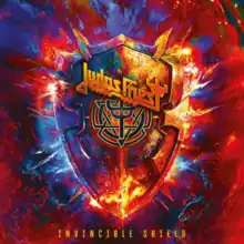 A multi-coloured shield surrounded by fire and light with Judas Priest's logo on it against a blue and red background