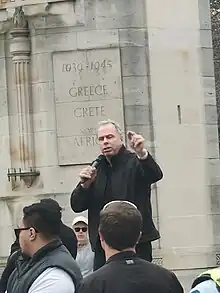 Julian Bachelor speaking at a rally