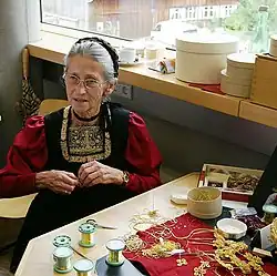 Woman fabricating a traditional juppe costume in Bezau (2007)