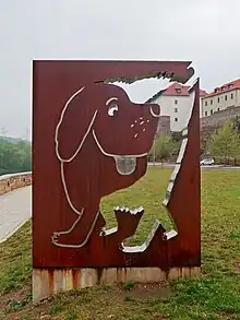 Sign with a silhouette of a dog cut out of it