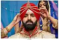 Kalgi placed on groom's turban