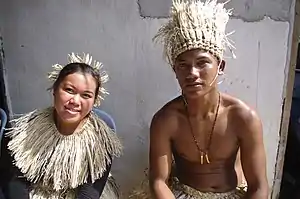 An Orang Seletar man and woman from Pasir Gudang, Johor in traditional attire.