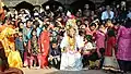 A person depicting god Ganesh sitting with the audience