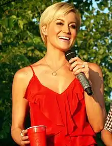 Pickler smiling while holding a microphone