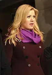 Kelly Clarkson standing