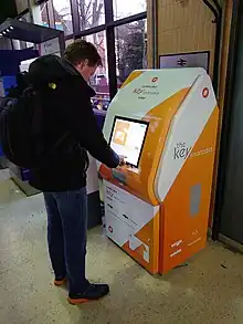 A person using a Key smartcard kiosk