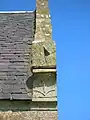 The sundial and Cunningham 'Y' 'Fork-Over' on the gable of the Glencairn Aisle.