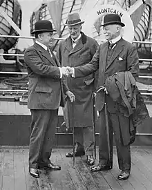 Prime Minister W.L. Mackenzie King and Sir George McLaren Brown being greeted by Hon. Peter Charles Larkin aboard S.S. MONTCALM en route to the Imperial Conference at London