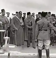 Image 4Abdulaziz (left) and Farouk checking an Egyptian Army unit in 1946. Other people picture include princes Fahd, Abdullah, and Mishaal,  as well as prince Muhammad Abdel Moneim. (from History of Saudi Arabia)