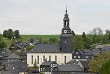 Church and houses, slate-faced.