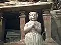 Kneeling figure at front of Gerard family memorial, perhaps representing a daughter who predeceased her parents.