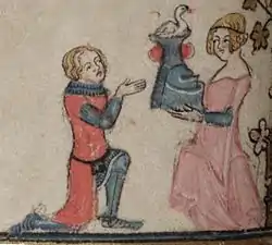 Maiden presents kneeling knight with swan-crested helmet (f.101v)