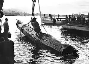 A Japanese Ko-hyoteki class midget submarine, believed to be Midget No. 14, is raised from Sydney Harbour