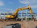 Komatsu PC210 LC excavator during peak summer conditions in San Antonio, Texas