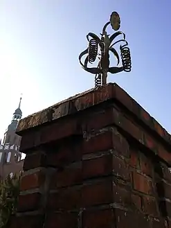 Flower-shaped wrought iron decoration of the fencing