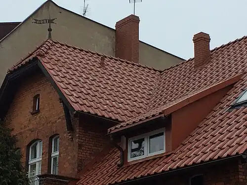 Detail of the gable and the weather vane