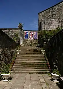 Three flags dedicated to Australian, British and New Zealanders soldiers in Kundasang War Memorial, Ranau, Sabah, Malaysia.