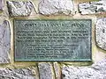 A metal nameplate describing history of the bridge