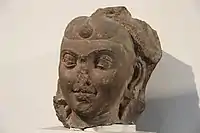 An example of hairstyle with frontal bun, under the Kushans