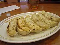 A plate of fried dumplings (gyōza)