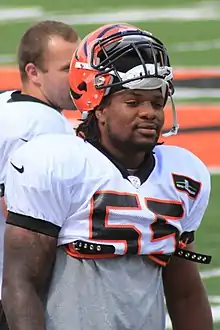 Burfict stands with his helmet half on his head