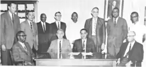 All-male medical staff posing for a photo.