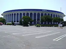 A concrete building with the words "Great Western Forum" on top situates across an empty parking lot