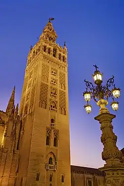 Image 10GiraldaPhoto: David IliffThe Giralda is a 104.5 m (343 ft) tall bell tower for the Seville Cathedral in Seville, Andalusia, Spain. It was originally constructed as a minaret in 1198, when Seville was ruled by the Almohad Caliphate. After the city was taken by the Christians in the Reconquista, the city's mosque was converted to a church. The upper third of the structure was completed during the Spanish Renaissance.More selected pictures